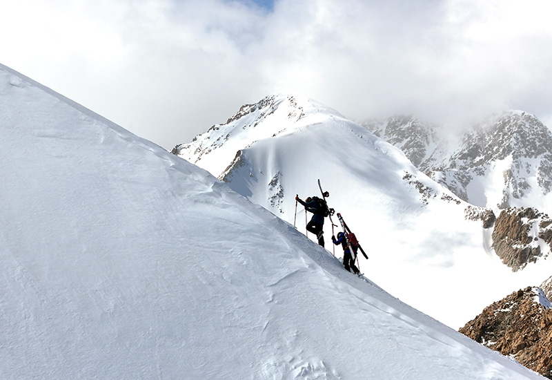 Skiers on top of the Altai mountains